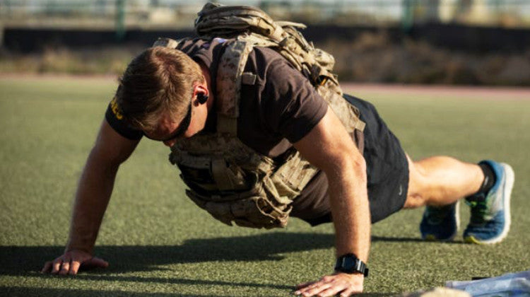 Why do military push-ups to progress in bodybuilding?